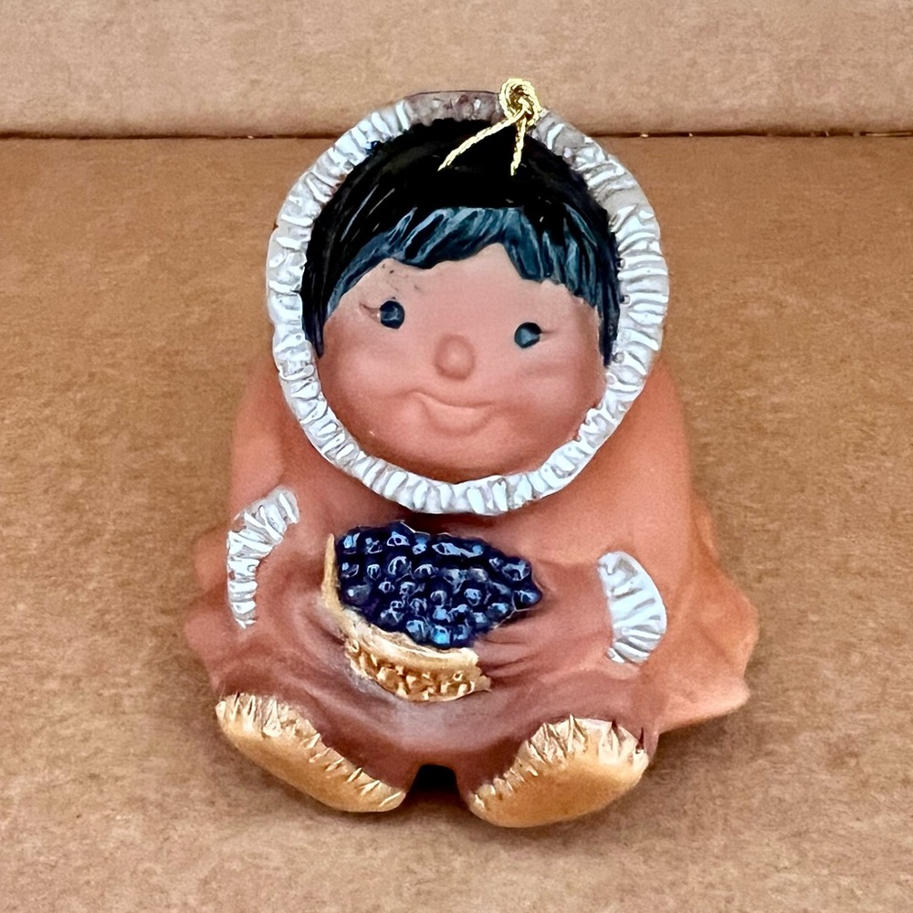 Vintage Nanook Eskimoโ Girl with Blueberries Tree Clay Ornament